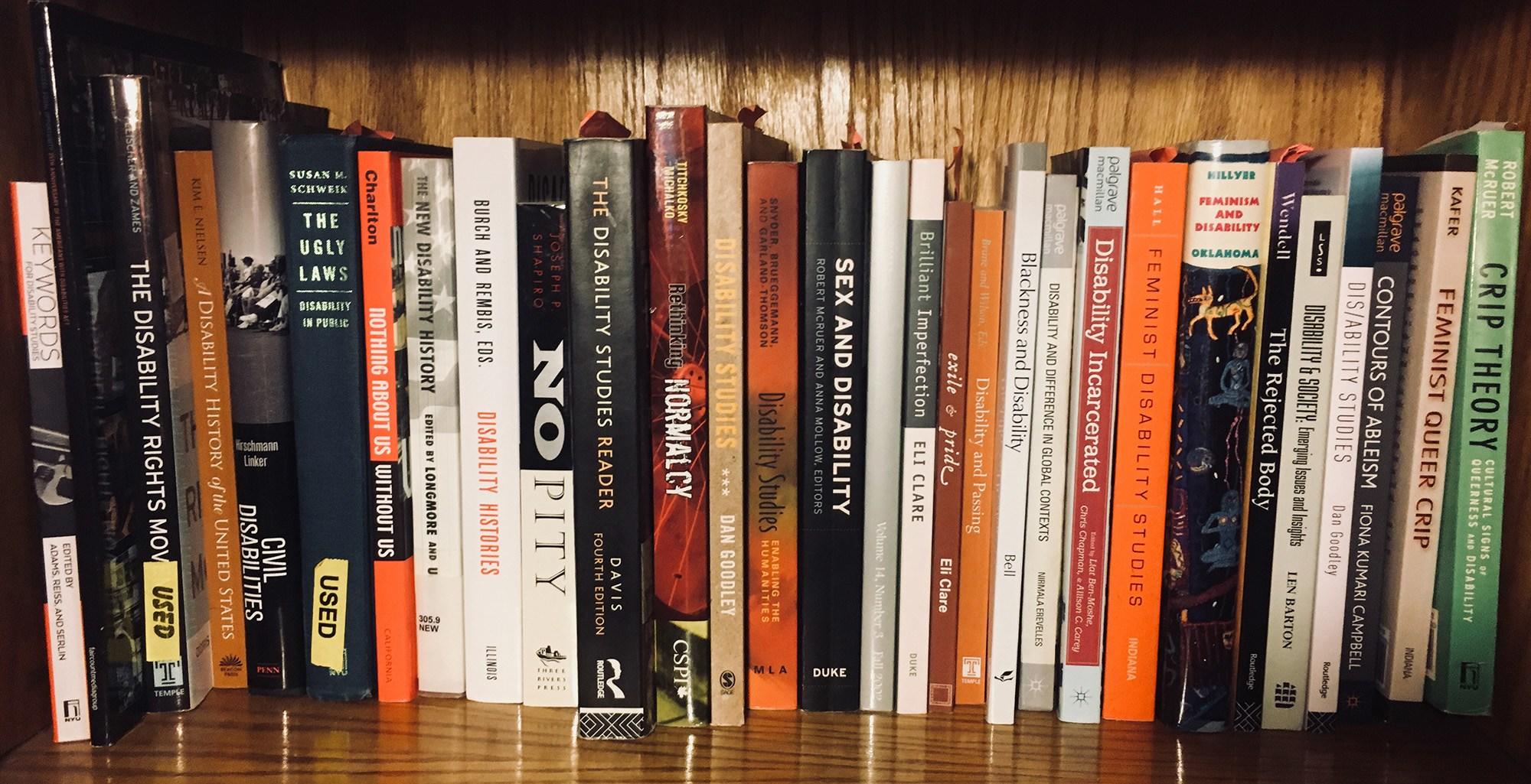 Bookshelf with books on critical disability studies